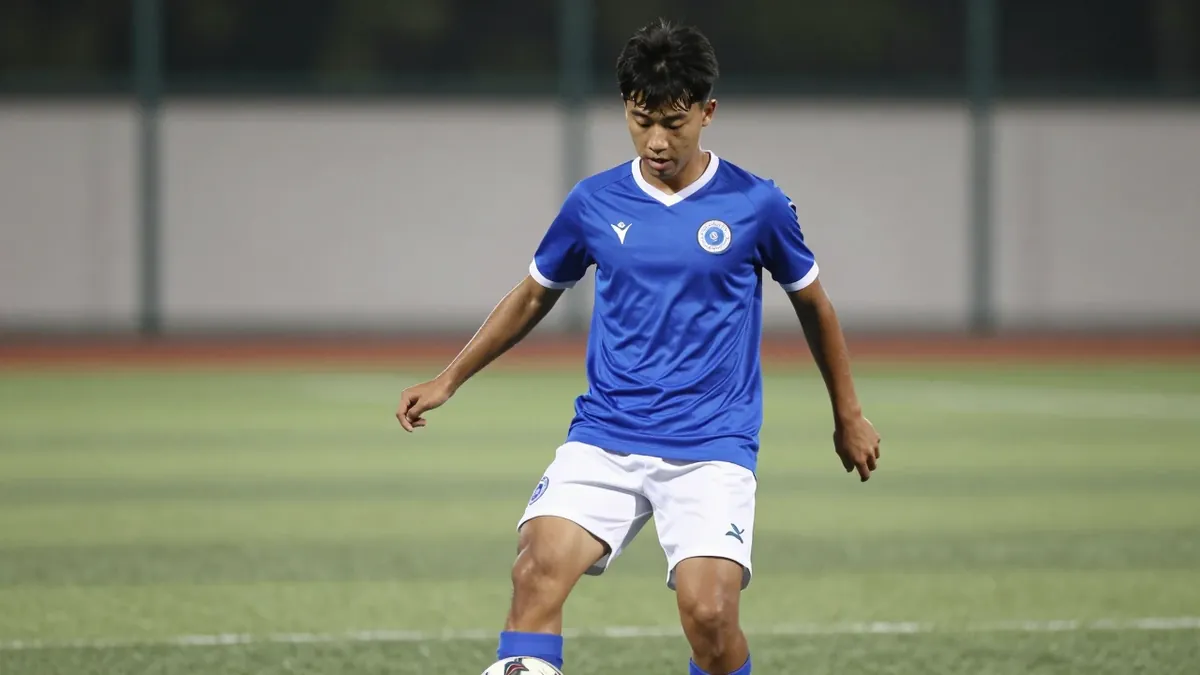 A photorealistic image of an anonymous 19-year-old midfielder in a blue jersey with white shorts, playing with a ball at...